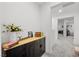 Hallway featuring built-in storage, modern decor, and bright, neutral finishes at 6144 Rathbone St, Las Vegas, NV 89166