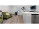 Modern living space with stylish decor, comfortable seating, and an open floor plan connecting to the kitchen at 6144 Rathbone St, Las Vegas, NV 89166
