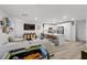 Bright and airy living area open to modern kitchen, offering a seamless flow at 6144 Rathbone St, Las Vegas, NV 89166