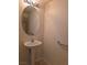 Powder room features a pedestal sink, oval mirror, and clean white walls at 6461 Za Zu Pitts Ave # 102, Las Vegas, NV 89122