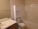 Bathroom features a tub and shower combination and coordinating cabinets at 6461 Za Zu Pitts Ave # 102, Las Vegas, NV 89122
