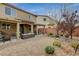 Landscaped backyard featuring a covered patio, pergola, and decorative gravel at 6470 Little Harbor Ct, Las Vegas, NV 89141