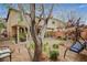 Expansive backyard with a covered patio, swing, and low-maintenance landscaping at 6470 Little Harbor Ct, Las Vegas, NV 89141