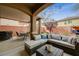 Covered backyard patio area with an outdoor seating area at 6470 Little Harbor Ct, Las Vegas, NV 89141
