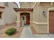 Welcoming front entrance with a covered porch and attractive landscaping at 6470 Little Harbor Ct, Las Vegas, NV 89141