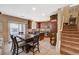 Open-concept kitchen featuring wooden cabinetry, island, and stainless steel appliances at 6470 Little Harbor Ct, Las Vegas, NV 89141