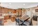 Well-equipped kitchen with wooden cabinetry, stainless steel appliances, and a functional center island at 6470 Little Harbor Ct, Las Vegas, NV 89141