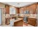 Beautiful kitchen with stainless steel appliances, granite countertops, and ample cabinet space at 6470 Little Harbor Ct, Las Vegas, NV 89141