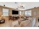 Comfortable living area with neutral decor, lots of natural light, and ceiling fan at 6470 Little Harbor Ct, Las Vegas, NV 89141