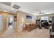 Spacious living area with carpet, ceiling fan, and access to an office space at 6470 Little Harbor Ct, Las Vegas, NV 89141