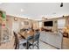 Spacious living room and dining area with tile flooring and comfortable seating arrangements at 6470 Little Harbor Ct, Las Vegas, NV 89141