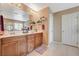 This main bathroom boasts double sinks, neutral walls, tile flooring, and white cabinets for storage at 6470 Little Harbor Ct, Las Vegas, NV 89141