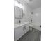 Nicely updated bathroom featuring modern vanity, lighting, and dark hardware at 6586 Mount Roy Ln, Las Vegas, NV 89156