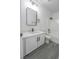 Nicely updated bathroom featuring modern vanity, lighting, and dark hardware at 6586 Mount Roy Ln, Las Vegas, NV 89156