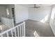 Carpeted bedroom with ceiling fan and ample natural light from the window at 6586 Mount Roy Ln, Las Vegas, NV 89156