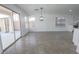 Bright living area featuring tile floors and a large sliding glass door at 6586 Mount Roy Ln, Las Vegas, NV 89156