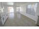 Bright living area featuring modern lighting fixtures, large windows, and tile floors at 6586 Mount Roy Ln, Las Vegas, NV 89156