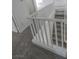 Carpeted staircase with white banister and railing at 6586 Mount Roy Ln, Las Vegas, NV 89156