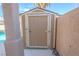 Exterior shot of storage shed beside pool area at 6586 Mount Roy Ln, Las Vegas, NV 89156