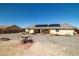 Outdoor dining area in backyard with low maintenance desert rock landscaping at 6751 Stubblefield Dr, Pahrump, NV 89061