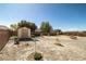 Backyard with a shed and gravel landscaping, offering a low-maintenance outdoor space at 6751 Stubblefield Dr, Pahrump, NV 89061