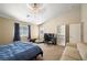 Bedroom with carpet, fan, neutral colors and door to exterior at 6751 Stubblefield Dr, Pahrump, NV 89061