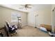 Bedroom featuring neutral walls, ceiling fan, and a window for natural light at 6751 Stubblefield Dr, Pahrump, NV 89061
