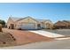 Charming single story home featuring a two car garage and desert landscaping at 6751 Stubblefield Dr, Pahrump, NV 89061