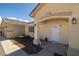 Inviting covered front entrance with seating area, desert landscaping, and charming decor at 6751 Stubblefield Dr, Pahrump, NV 89061