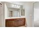 Bright bathroom with double vanity, tile floors, and access to walk in closet at 6773 Goose Watch Ct, Las Vegas, NV 89139