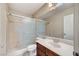 Bathroom with shower, toilet, vanity with sink, and large mirror at 6773 Goose Watch Ct, Las Vegas, NV 89139