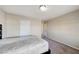 Bedroom with carpet, queen-sized bed, and door that leads to hallway at 6773 Goose Watch Ct, Las Vegas, NV 89139