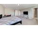 Bright bedroom featuring neutral carpet, modern furniture, and multiple entryways at 6773 Goose Watch Ct, Las Vegas, NV 89139