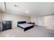 Neutral bedroom featuring neutral carpet, modern furniture, and recessed lighting at 6773 Goose Watch Ct, Las Vegas, NV 89139