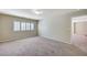 Spacious bedroom featuring neutral carpet and shuttered windows at 6773 Goose Watch Ct, Las Vegas, NV 89139