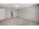 Spacious bedroom featuring neutral walls, carpet, and access to an en-suite bathroom at 6773 Goose Watch Ct, Las Vegas, NV 89139