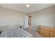 Neutral bedroom with carpet, full-sized bed, and view to hallway at 6773 Goose Watch Ct, Las Vegas, NV 89139