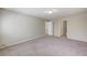 Spacious bedroom featuring neutral carpet and multiple doors at 6773 Goose Watch Ct, Las Vegas, NV 89139