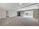 Large bonus room with recessed lighting, sliding glass door, and neutral-toned carpet at 6773 Goose Watch Ct, Las Vegas, NV 89139
