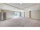 Large bonus room with recessed lighting, sliding glass door, and neutral-toned carpet at 6773 Goose Watch Ct, Las Vegas, NV 89139