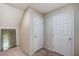 Hallway featuring neutral carpet and multiple white doors at 6773 Goose Watch Ct, Las Vegas, NV 89139