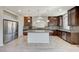 Spacious kitchen with stainless steel appliances, ample counter space, and a large island perfect for meal preparation and dining at 6773 Goose Watch Ct, Las Vegas, NV 89139