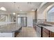 Modern kitchen featuring a large island, stainless steel appliances, granite countertops, and ample cabinet space at 6773 Goose Watch Ct, Las Vegas, NV 89139