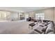Expansive living area with neutral carpeting, recessed lighting, and ample space for entertaining at 6773 Goose Watch Ct, Las Vegas, NV 89139