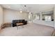 Spacious living room features a comfortable seating area and seamless transition to the kitchen and dining spaces at 6773 Goose Watch Ct, Las Vegas, NV 89139