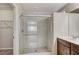 Bathroom featuring a glass enclosed shower and tile flooring at 6773 Goose Watch Ct, Las Vegas, NV 89139