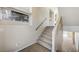 Carpeted staircase with a window providing natural light, offering a glimpse of the home's interior at 6773 Goose Watch Ct, Las Vegas, NV 89139