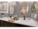Elegant dual sink bathroom vanity with framed mirrors and black fixtures at 6929 Benson Ferry St, Las Vegas, NV 89149