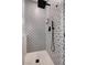 Modern bathroom with designer tile shower and matte black hardware for a luxurious feel at 6929 Benson Ferry St, Las Vegas, NV 89149