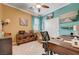 Charming bedroom with unique paint, decor and a ceiling fan for added comfort at 6929 Benson Ferry St, Las Vegas, NV 89149